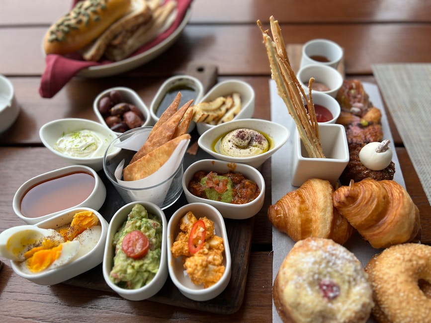 Beautiful brunch spread with eggs, pastries, and fresh fruit.