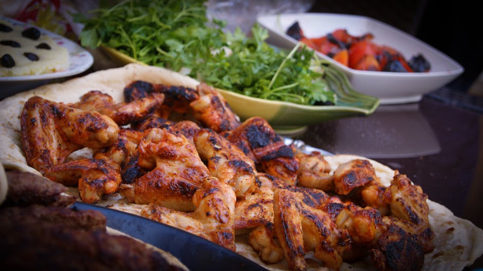 Golden roasted chicken with vegetables on a serving platter.