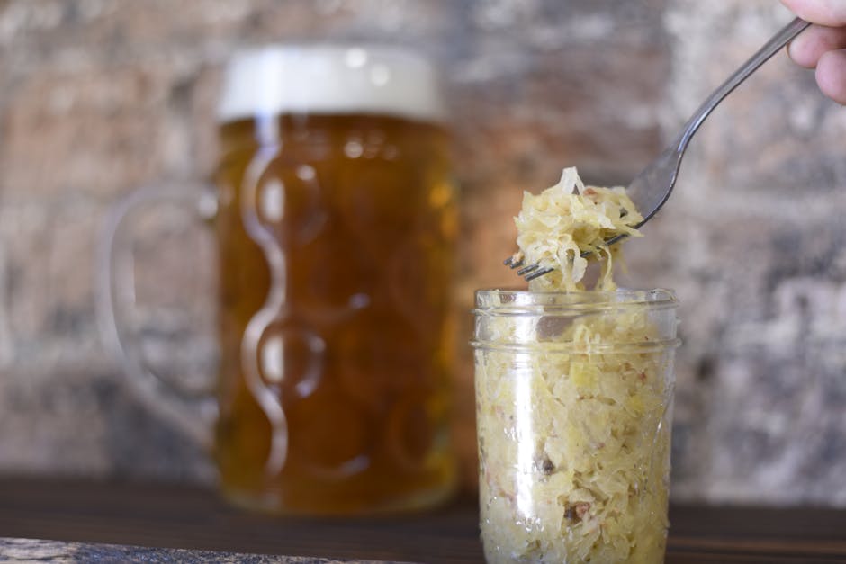 Jars of fermented foods including kimchi and sauerkraut.