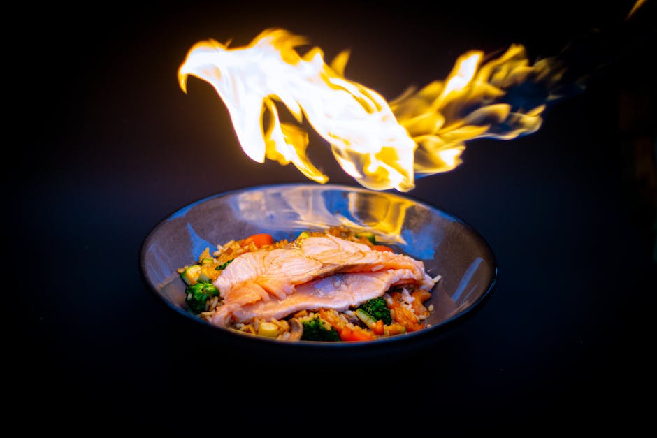 Grilled salmon with colorful heart-healthy vegetables on a plate.