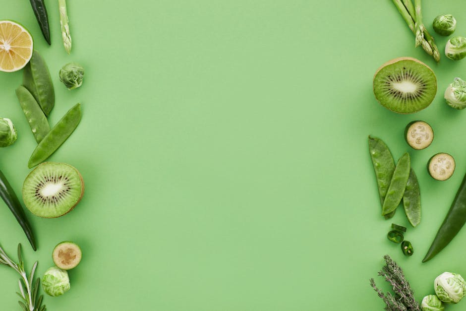 Fresh spring vegetables including asparagus and peas on a cutting board.